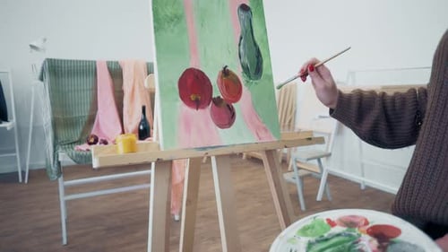 Making a Picture. Girl with a Brush Draws a Still Life