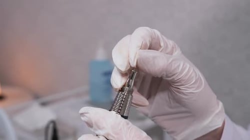 Medical Hand Inserts Needle Into Device