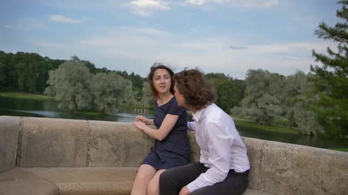 Romantic Couple Embracing by Serene Lakeside Park
