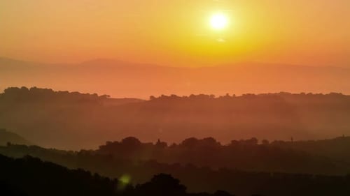 Sunrise Time Lapse Over Hills and Mountains