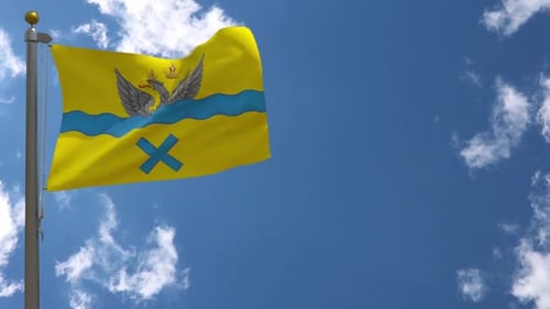 Waving Flag with Double-Headed Eagle Against Blue Sky