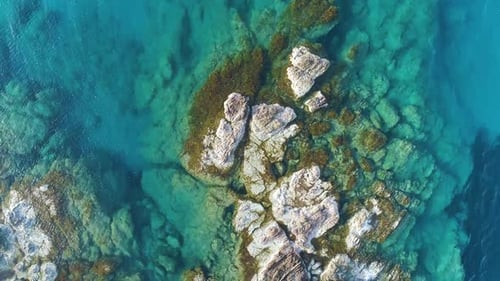 Beautiful Rocky Sea Coast Turquoise Ocean Waves Break on High Cliff of a Rocky Mountain