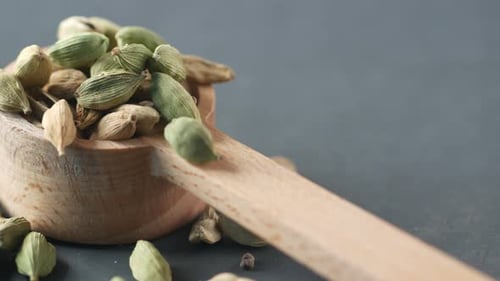 Close Up of Cardamom on a Spoon on Table