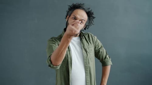 Angry Man Making Threatening Gestures