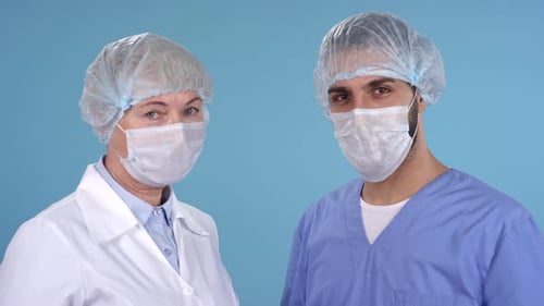 Healthcare Workers Wearing Masks and Surgical Caps
