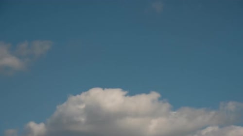 Clouds Drifting Across a Blue Sky