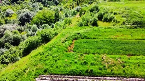 Aerial drone view of a flying over the rural agricultural landscape.