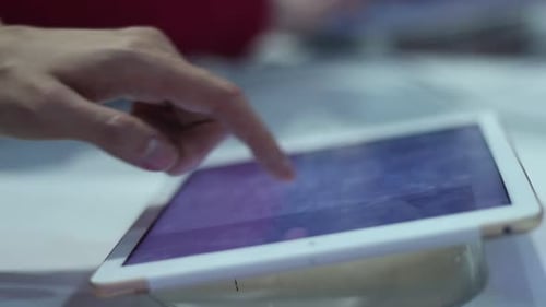 Young Man Uses A Tablet In The Office