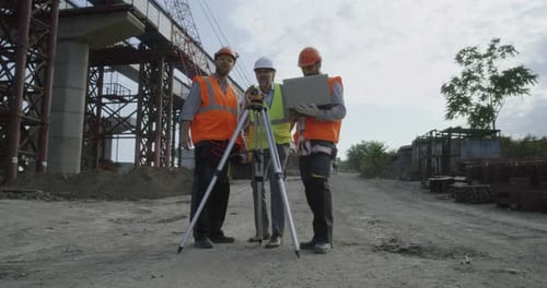 Contractors Working on Plan of Construction