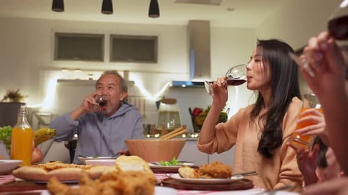 Family Dinner Celebration with Pizza and Drinks