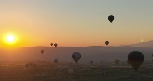 Aerial Cinematic Drone View of Colorful Hot Air Balloon Flying Over Cappadocia
