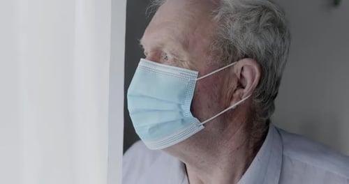 Adult wearing a surgical mask