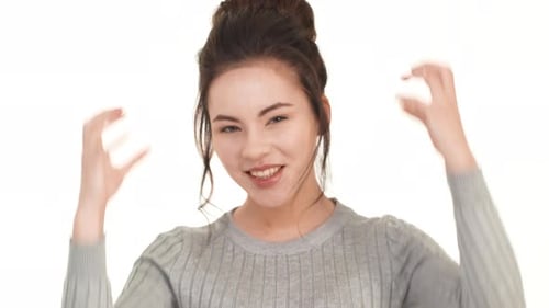 Excited Woman Smiling and Pumping Fists