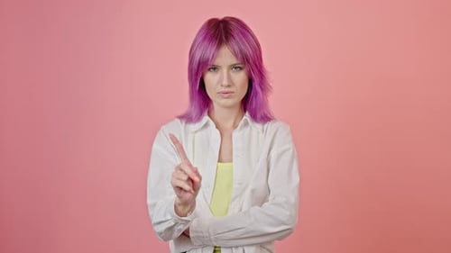 Pink Haired Woman Gesturing No on Pink Background