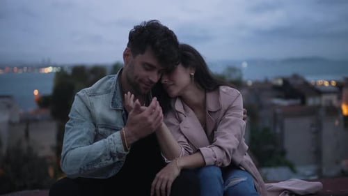 Couple Hugging in the Evening City