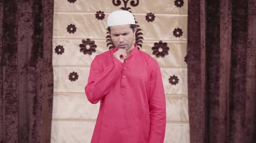 Man Wearing Cap Has Idea and Points Up