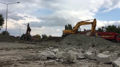 Construction Vehicles Working on Road Improvement Project