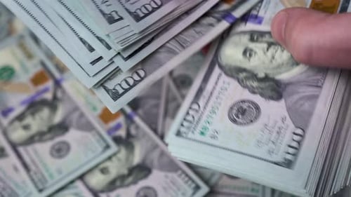 Stacks of One Hundred Dollar Bills Close Up