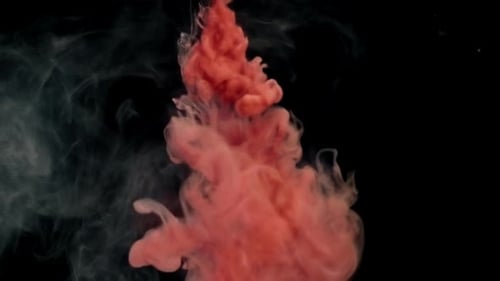 Red Paint and White Smoke on Black Background