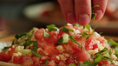 Delicious Salad Being Topped with Greens