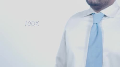 Man Writes 100 Percent on Transparent Surface