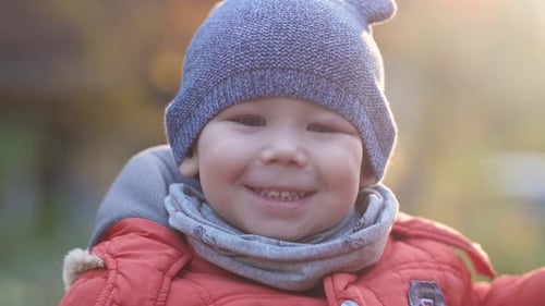 Smiling Child Enjoying a Sunny Day Outdoors