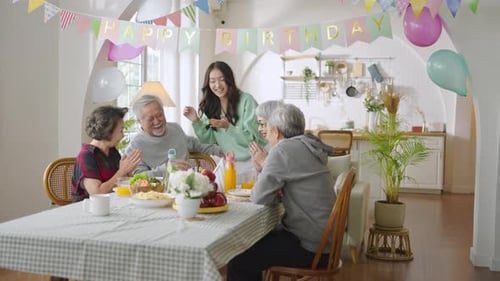 Family Celebrates Birthday at Home with Loved Ones