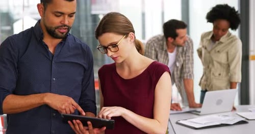 Team Collaborates on a Tablet in Office