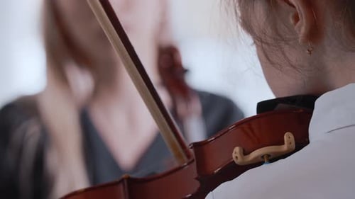 Close-Up of Violinists Playing Elegant Classical Music