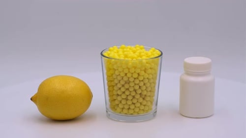 Lemon, Glass of Pills, and Pill Bottle
