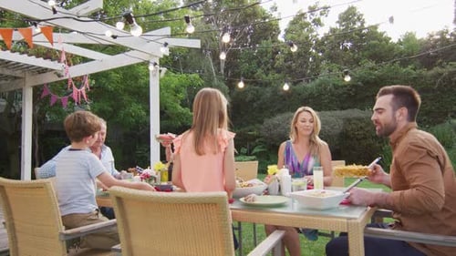 Family Enjoys Birthday Meal Outdoors
