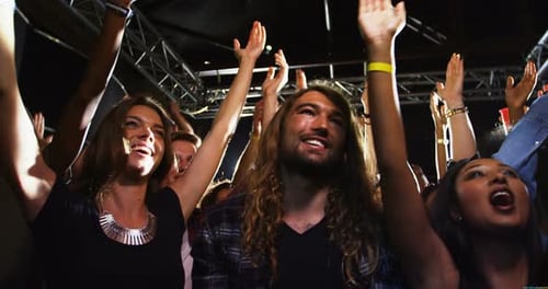 Excited Concert Crowd Enjoying Live Music Show