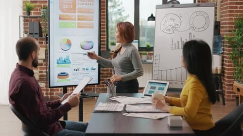 Business Team Discussing Data in Modern Office