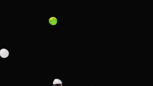 Colorful Spheres Bouncing and Floating on Black Background