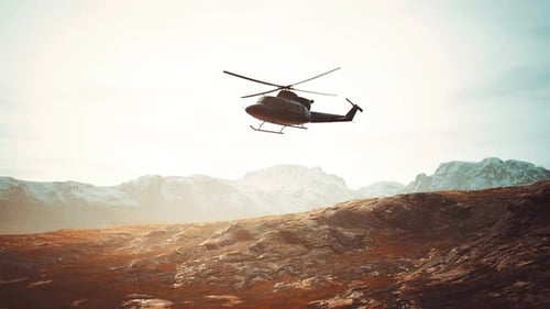 Slow Motion Vietnam War Era Helicopter in Mountains