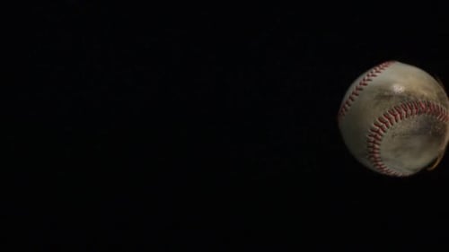 Baseball Spinning Slowly in the Dark
