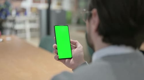 Man Using Smartphone with Green Screen