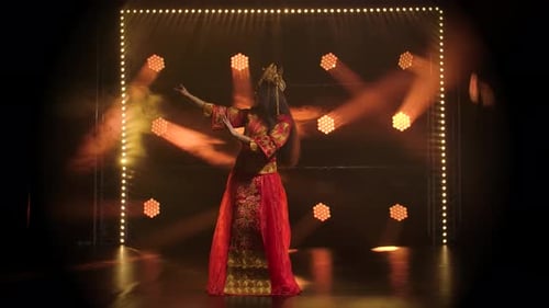 Theatrical Performance Woman Dancer in Red Silk Costume and Headdress of a Chinese princess.China