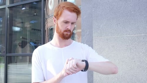 Young Adult Uses Smart Watch Outdoors