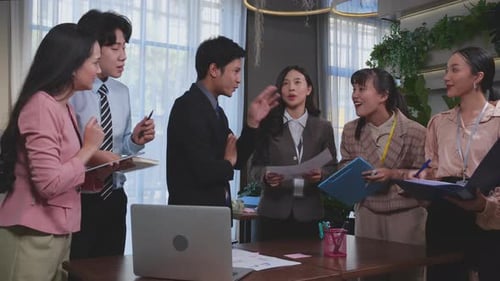 Happy Business Team Celebrates Success in Office