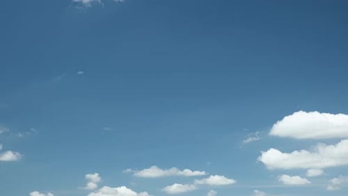 White Clouds Drifting Across Blue Sky