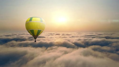 Aerial View Balloon Flying at Sunset Over the Clouds. Balloon Flight Above the Clouds. The Sun's