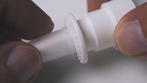 Fingers Opening Nasal Spray Nozzle Macro Shot