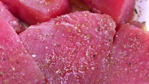 Close up of Raw Seasoned Tuna Steaks
