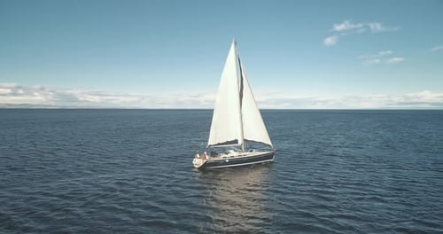 Slow Motion of Yacht Reflection at Sea Gulf Aerial