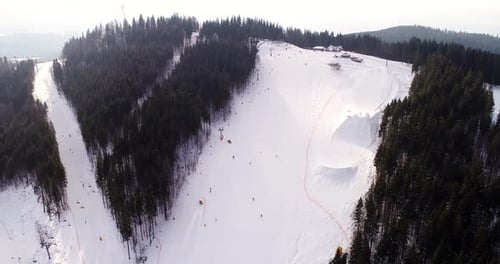 Beautiful Aerial View of the Small Winter Town in the Middle of Mountains