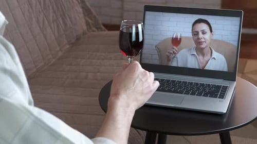 Friends Socializing Online Using Video Call, Drinking Wine