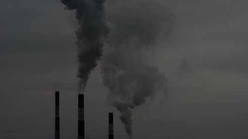 Smoke From Pipes in the Air. Large Pipes of Industrial Factory Produce Chemical Smoke in the Evening