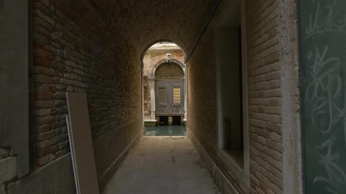 Venetian Canal Visible Through Narrow Passage