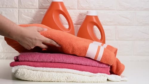 Towels and Laundry Detergent Bottles